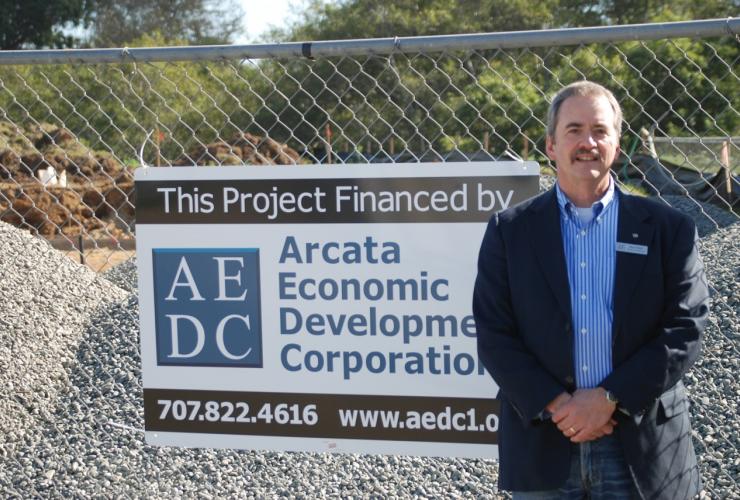 Ross Welch on location with AEDC sign
