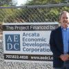 Ross Welch on location with AEDC sign